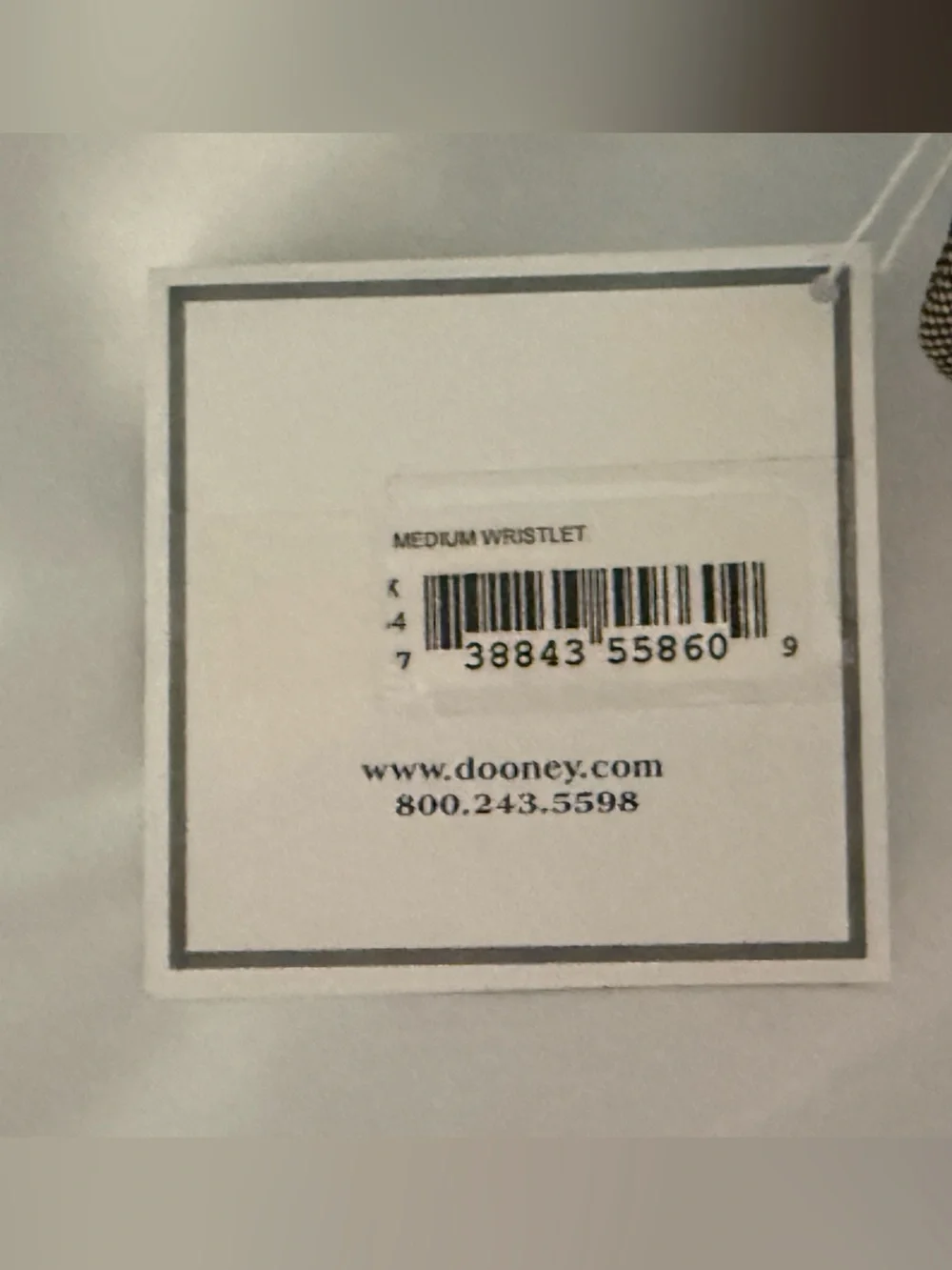 Dooney and Bourke NWT Medium logo wristlet. Comes in a box!